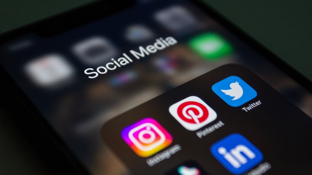 Photo by Shutter Speed a close up of a cell phone with social media icons on it